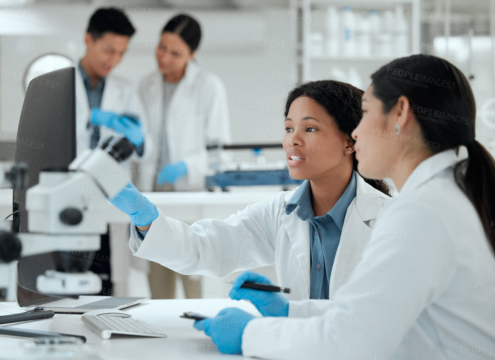 Buy stock photo Scientist, team and women with microscope in lab for medical experiment, development and coaching. Science, pharmaceutical and intern with biotech for Mpox vaccine, solution and learning epidemiology