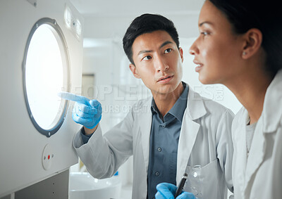 Buy stock photo Shot of two scientists eagerly waiting for test results
