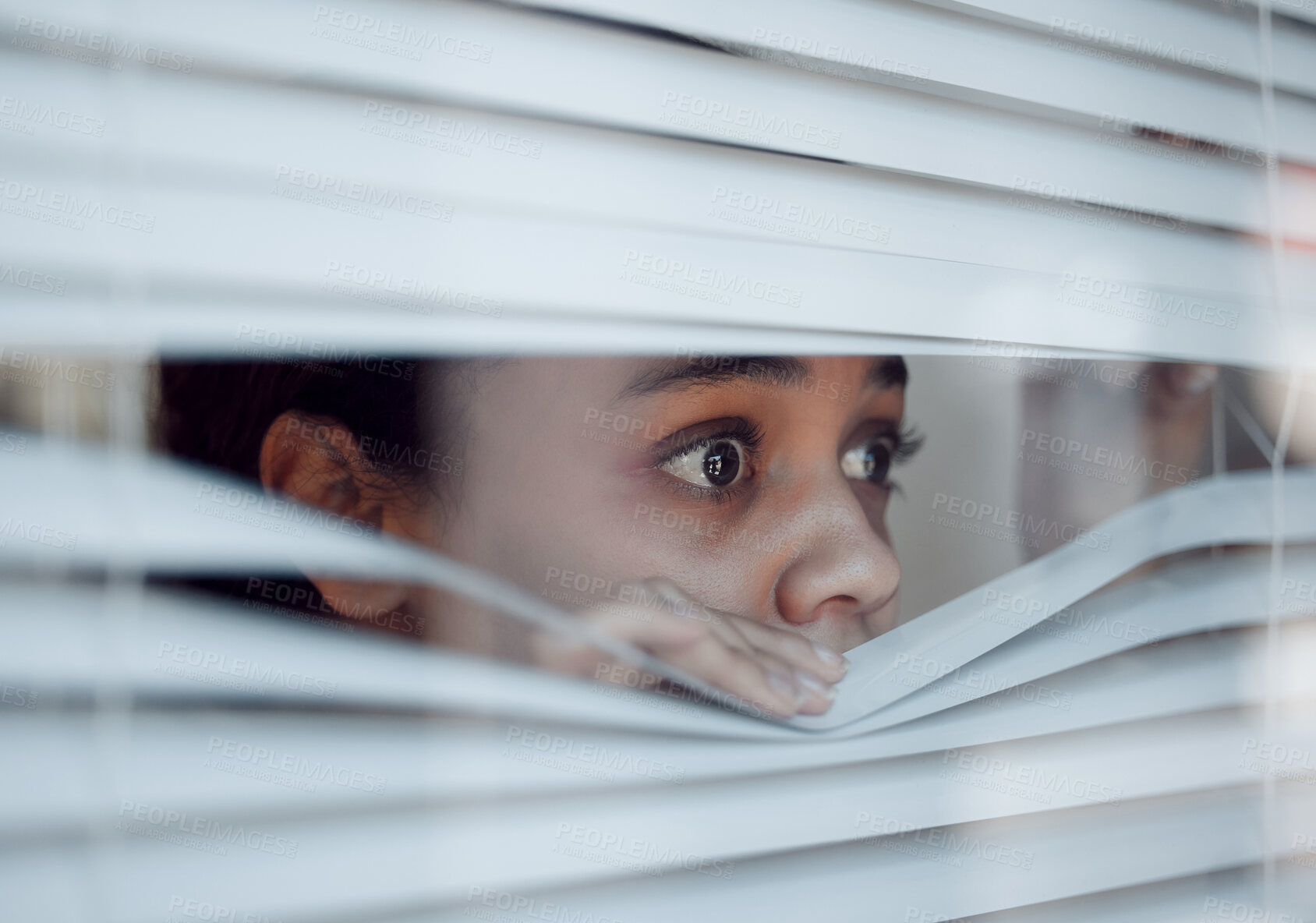 Buy stock photo Shot of a young female experiencing paranoia at home