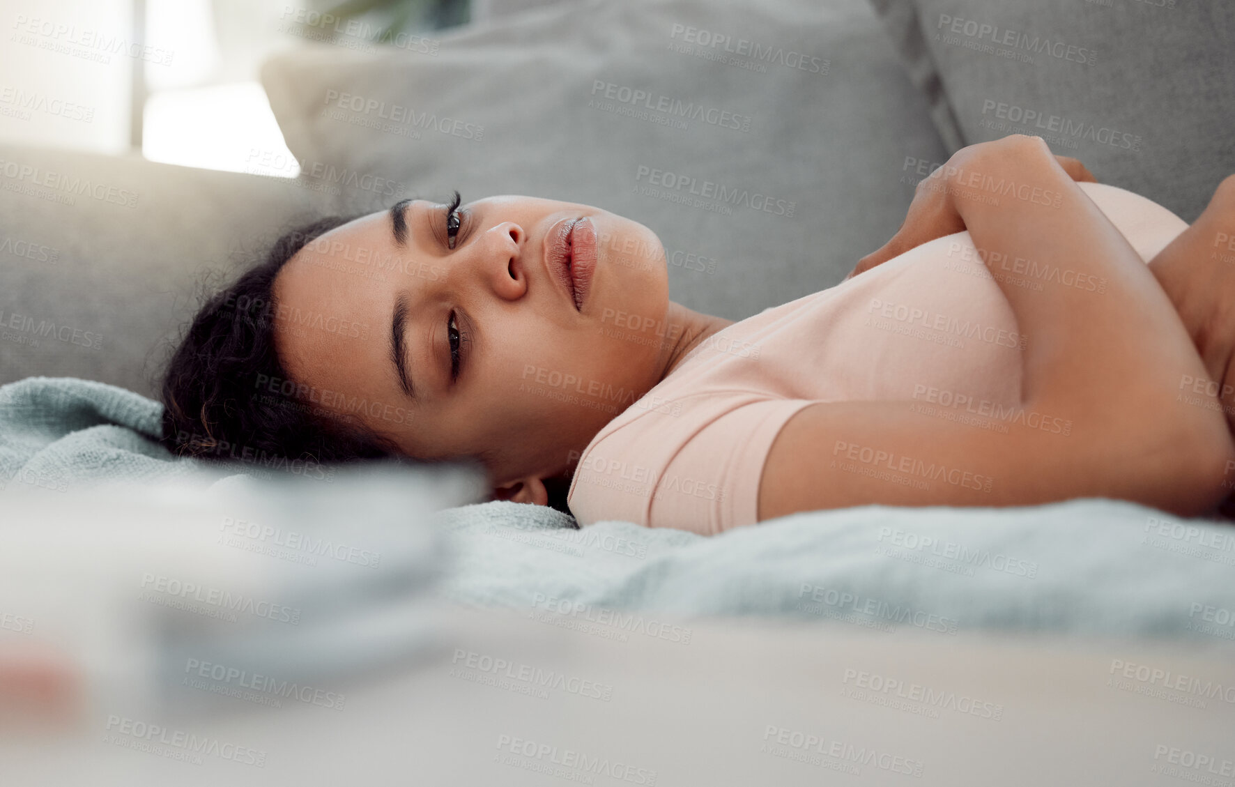 Buy stock photo Shot of an exhausted female sleeping through depression at home
