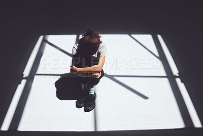 Buy stock photo Woman, window and light with depression in asylum above for abuse, mental illness or psychiatric ward. Top view, female person or patient crying for pain, trauma or anxiety of victim in isolation