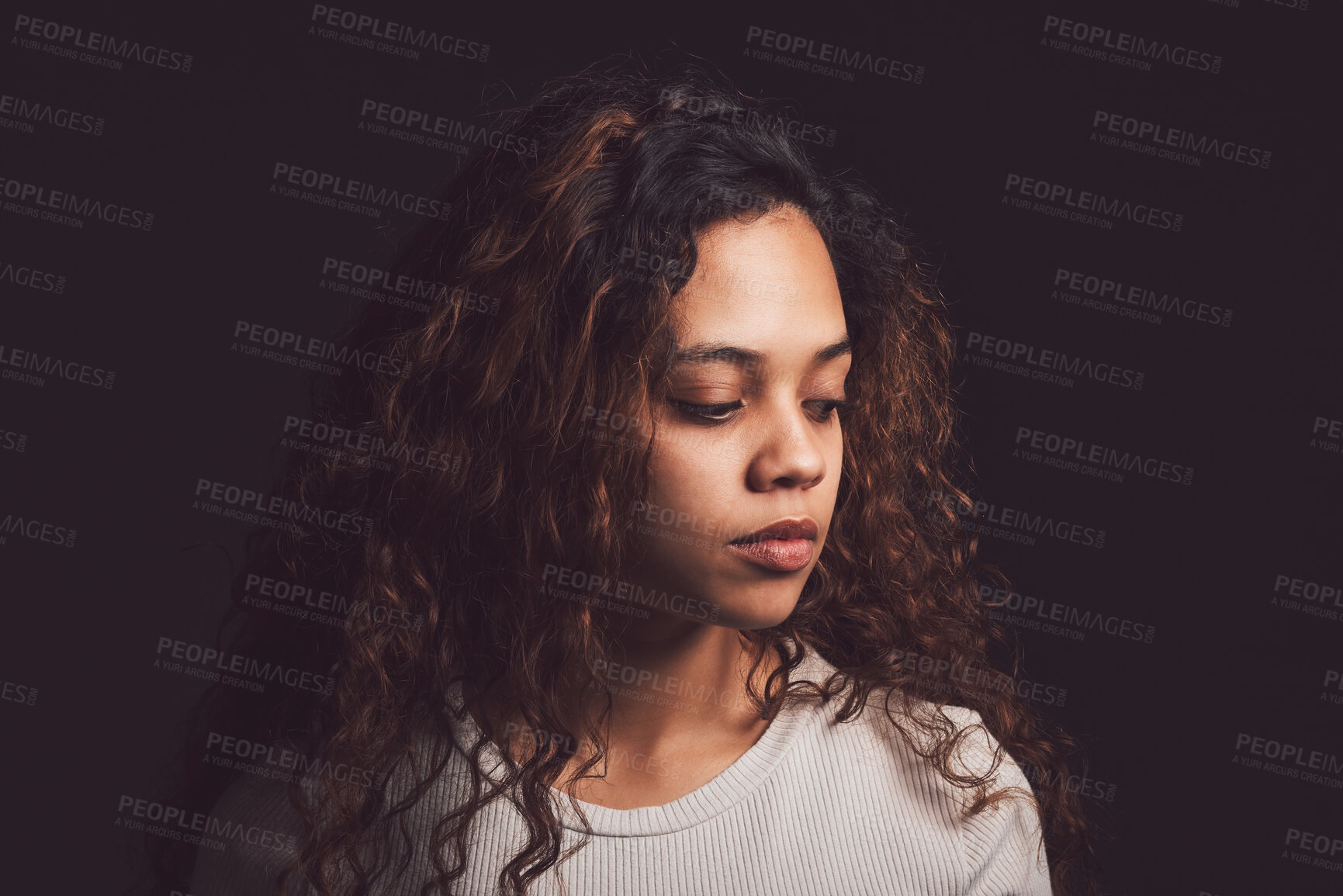 Buy stock photo Sad, thinking and person with bipolar disorder in studio for mental health, psychology and ptsd illness. Identity crisis, mindset and depression with woman on black background for mood swing mockup