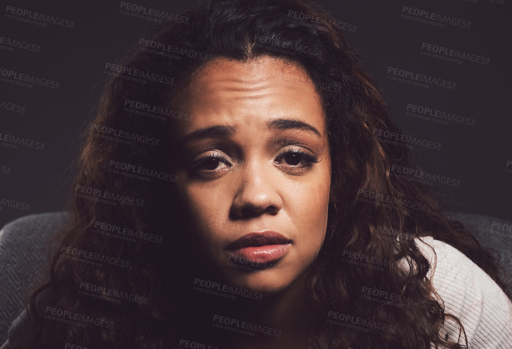 Buy stock photo Crying, portrait and person with bipolar disorder in studio for mental health, psychology and ptsd illness. Identity crisis, mockup and depression with woman on black background for mood swing 