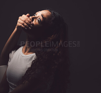 Buy stock photo Girl, hand and covering mouth in fear, anxiety and crying for mental health on dark background. Female person, bipolar and emotional in shock for care, therapy and healing as grief, loss and disorder