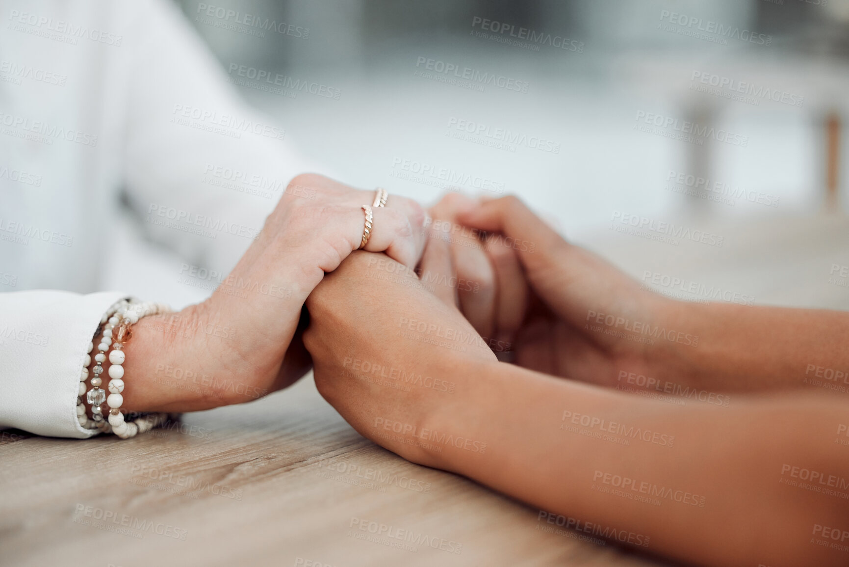 Buy stock photo Cropped shot of an unrecognisable psychologist sitting and comforting her patient during a consultation