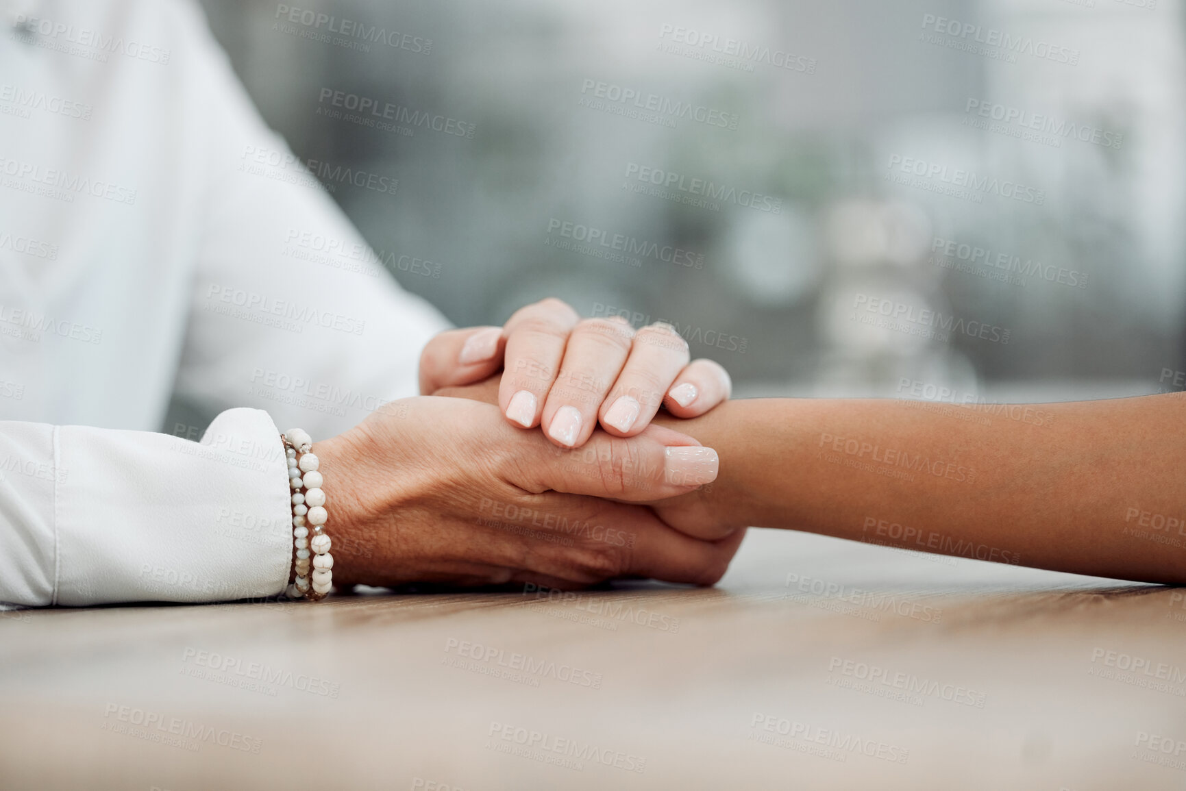 Buy stock photo Cropped shot of an unrecognisable psychologist sitting and comforting her patient during a consultation