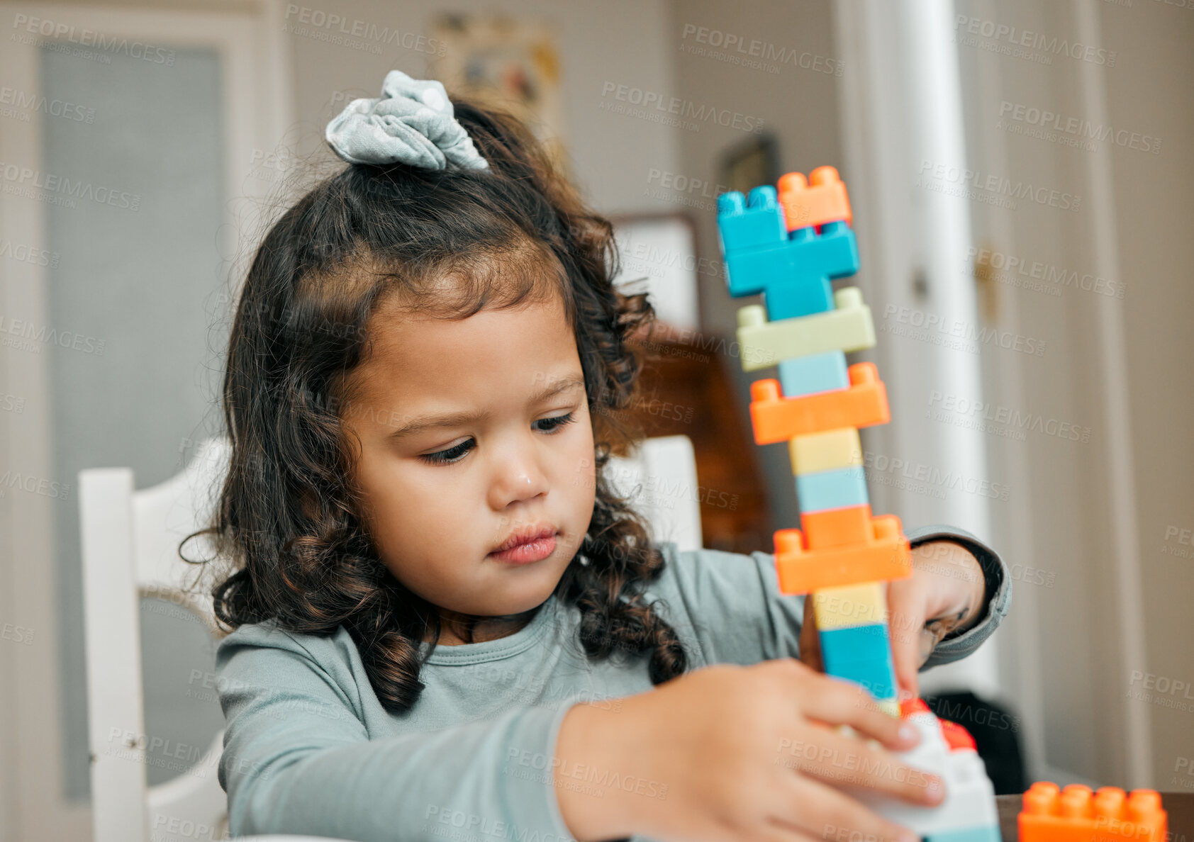 Buy stock photo Building blocks, education and game with girl and toy for learning, youth development and growth. Shapes, creative and imagination with child playing at home for Montessori puzzle, knowledge or skill