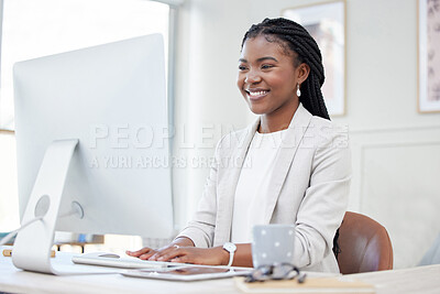 Buy stock photo Shot of a young african businesswoman working on her computer