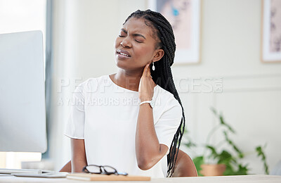 Buy stock photo Shot of a young businesswoman experiencing a neck cramp at work