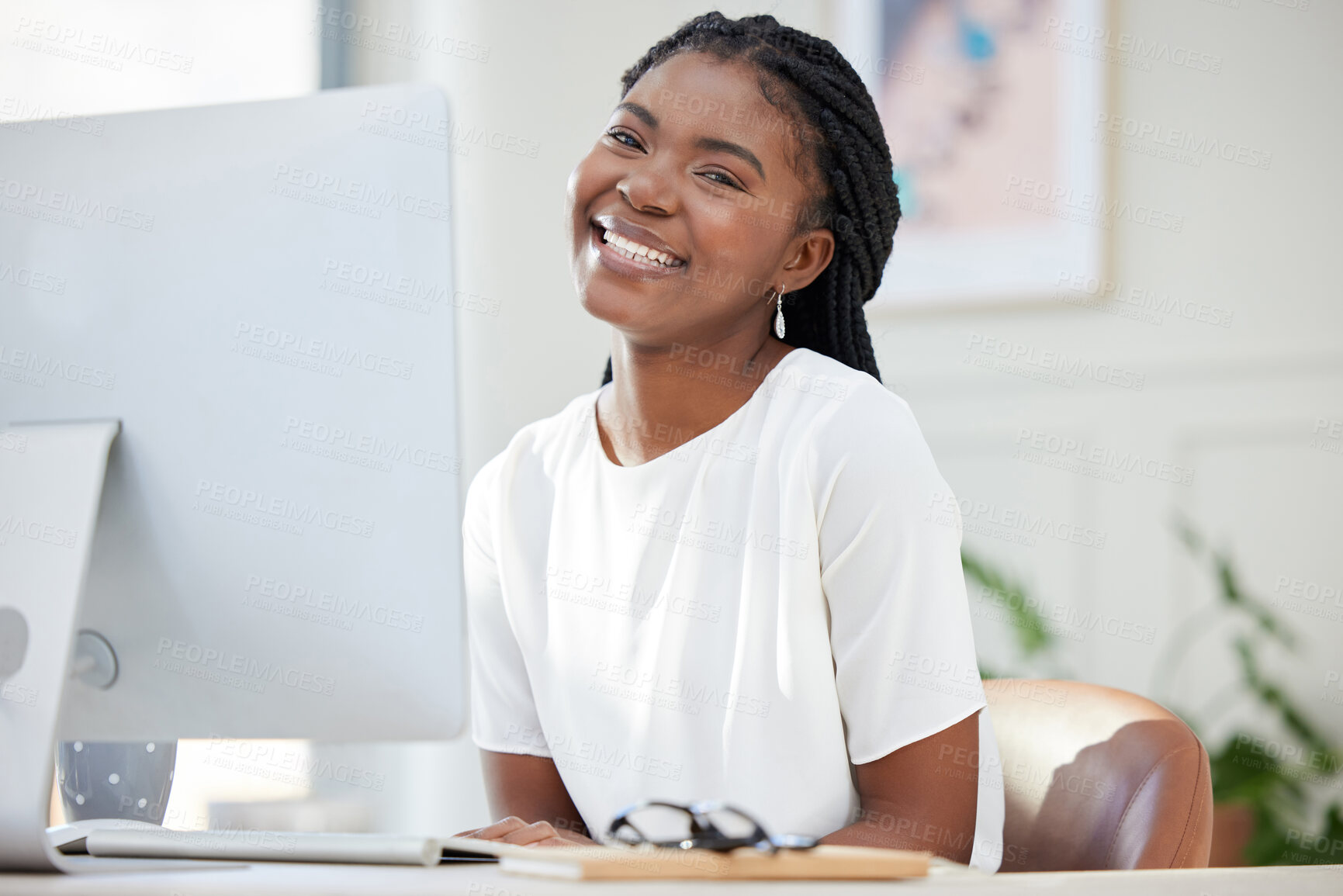 Buy stock photo Black woman, portrait and computer at startup with smile, pride and career in copywriting on web. Person, writer and happy by pc for editing, research and creativity in modern office at media agency