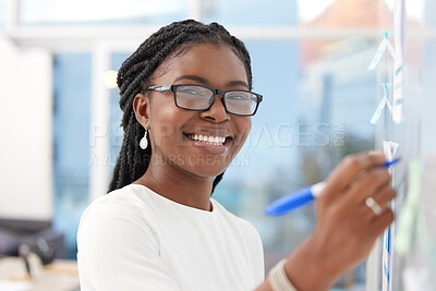 Buy stock photo Writing, face and black woman with happiness at board planning a business analyst project. African female person, portrait and professional with staff notes and moodboard working on company data