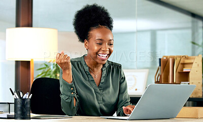Buy stock photo Shot of a young businesswoman cheering while using a laptop in an office at work