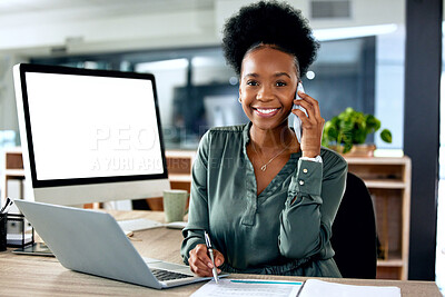 Buy stock photo Shot of a young businesswoman using a laptop while on a call at work