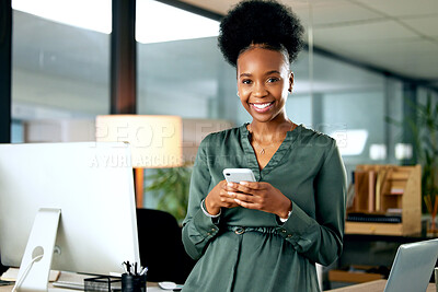 Buy stock photo Shot of a young businesswoman using a phone in an office at work