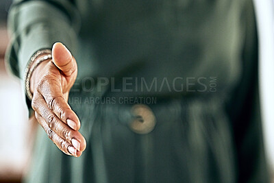 Buy stock photo Shot of an unrecognizable businessperson extending their hand out for a handshake at work