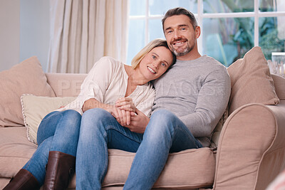 Buy stock photo Shot of a young couple bonding on the sofa at home