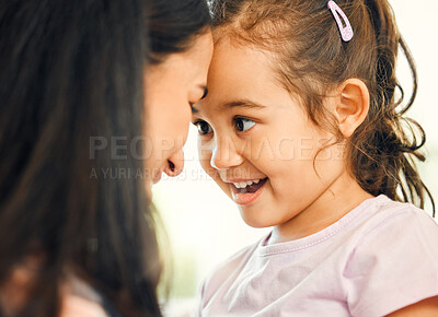 Buy stock photo Shot of a mother and daughter bonding at home