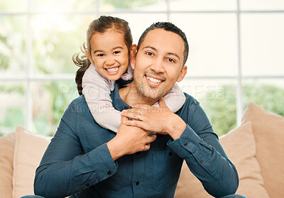 Buy stock photo Shot of a father and daughter bonding on the sofa at home