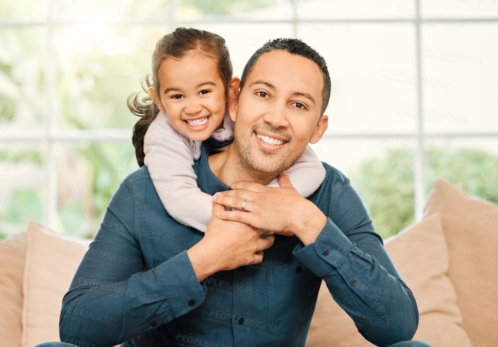 Buy stock photo Shot of a father and daughter bonding on the sofa at home