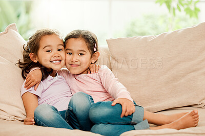 Buy stock photo Siblings, portrait and sisters hug in home with love, care and kids with smile, joy or love on sofa in living room. Happy girls, twins and playful children bonding on couch together in house for fun