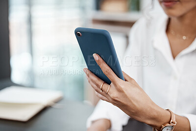 Buy stock photo Closeup shot of an unrecognizable businesswoman sending a text while working in her office