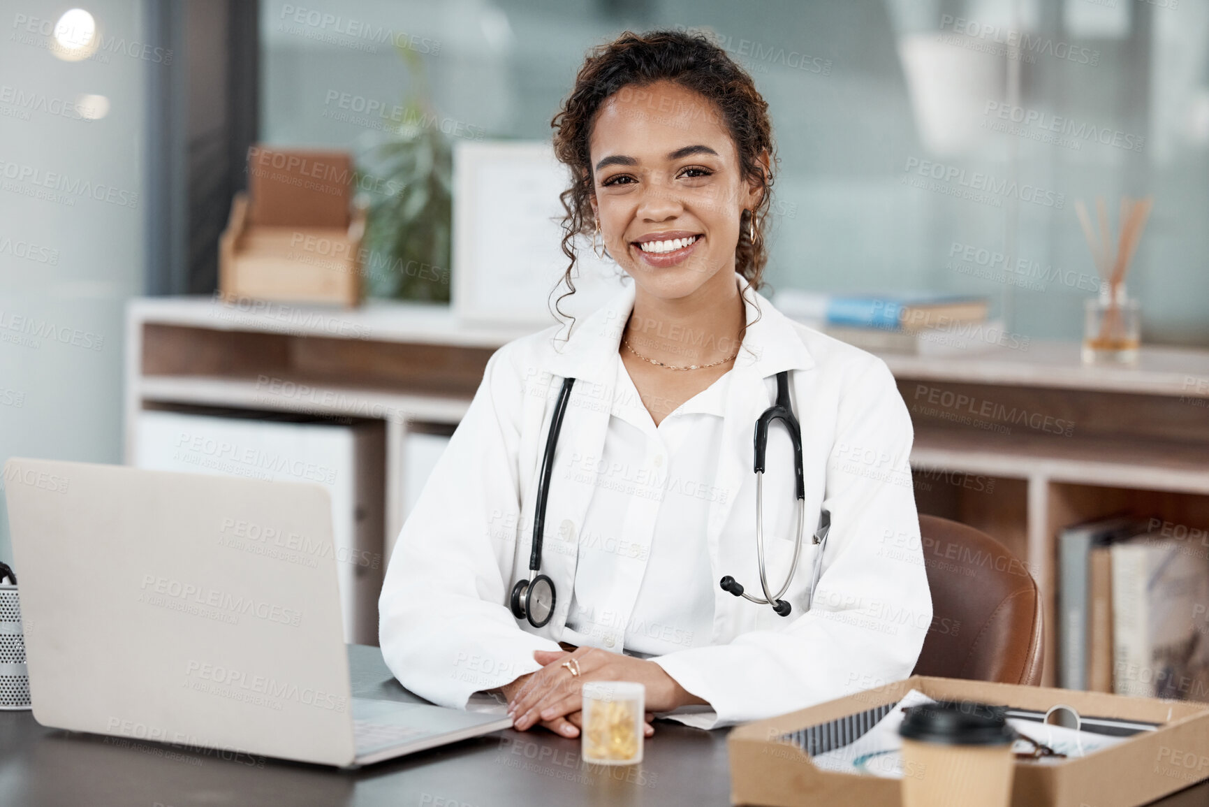 Buy stock photo Doctor, woman in portrait and smile, healthcare and medical professional in office with stethoscope and laptop. Female person in medicine, desk and health insurance with cardiologist at hospital