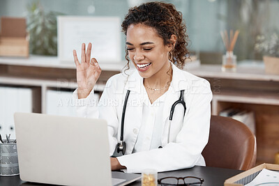 Buy stock photo Female doctor, laptop and okay with video call in office for meeting with remote consultation at desk. Woman, conference and virtual examination with telehealth or appointment schedule in Germany