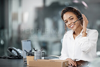 Buy stock photo Cropped portrait of an attractive young female call center agent working at her desk in the office