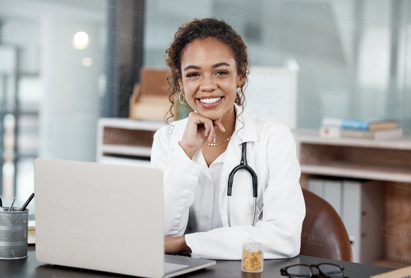 Buy stock photo Doctor, smiling or portrait with laptop on desk for virtual appointment, schedule or online meeting. Happy, woman and tech in workplace for client communication or social media health advice