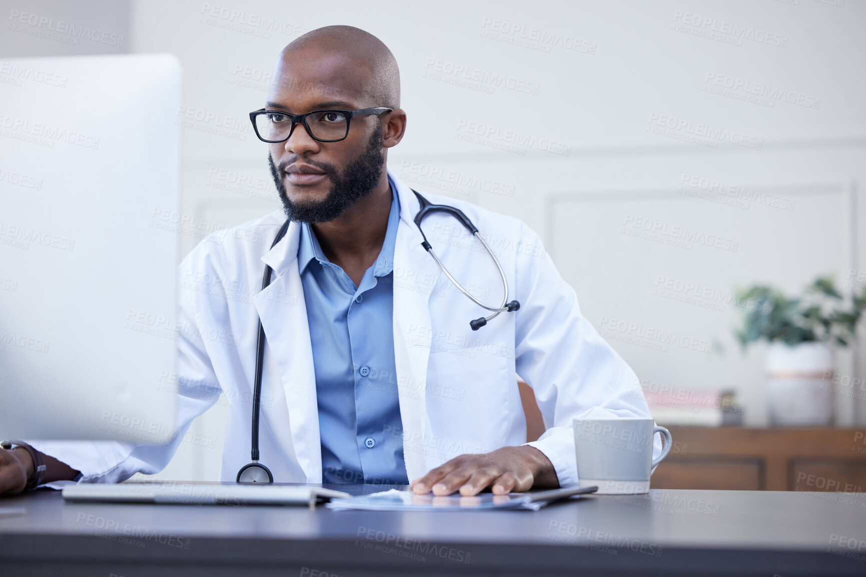 Buy stock photo Black man, serious doctor and computer focus with medical and healthcare research in office. Wellness, hospital and clinic data reading of a African male professional working on tech for health