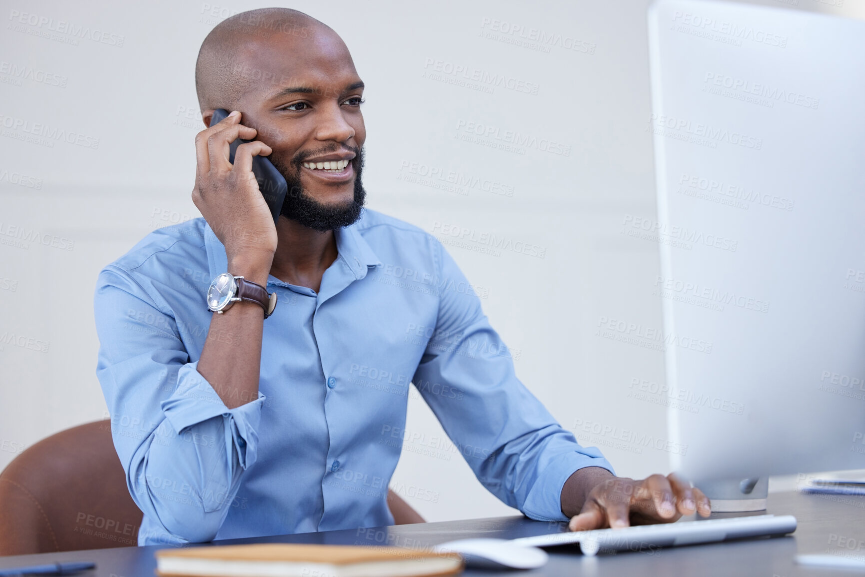 Buy stock photo Black man, office and conversation on phone call with computer for online research, information and ideas in start up company. Project manager, networking and smile for communication for business