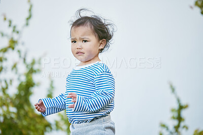 Buy stock photo Outdoor, boy and baby in backyard, sad and upset with breeze, calm and peaceful. House, outside and infant in garden, facial expression and emotions with reaction, childhood and tantrum with wind