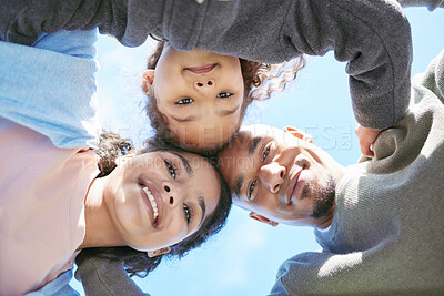 Buy stock photo Portrait, happy family and hug bellow outdoor for care, love or bonding on vacation, holiday and low angle. Smile, face of parents and children embrace together, having fun with blue sky outside