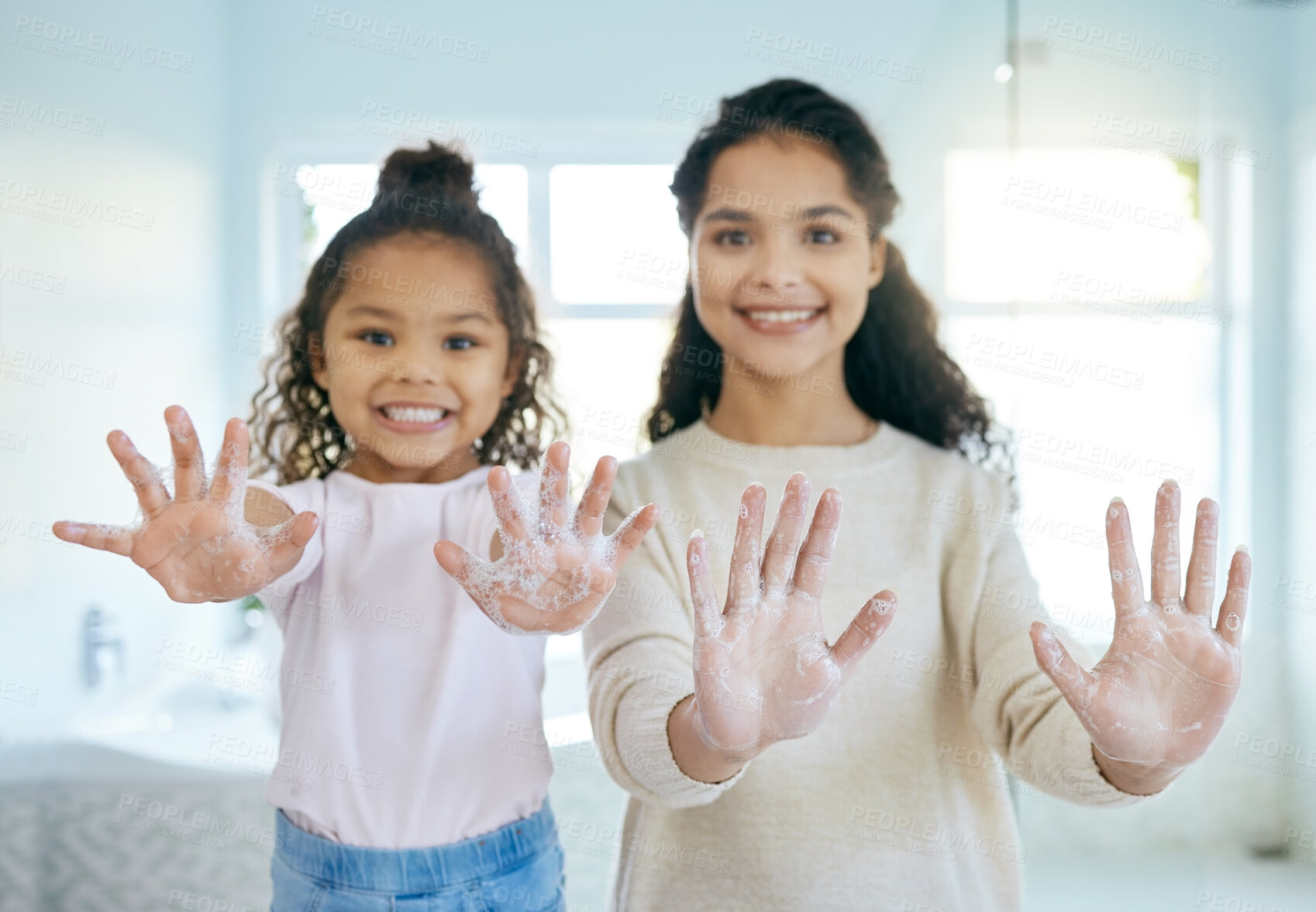 Buy stock photo Soap, cleaning hands and family with girl in bathroom for learning, healthy hygiene and routine at home. Portrait, mom and child washing with foam for safety of bacteria, dirt or germs on skincare