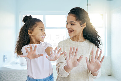 Buy stock photo Soap, cleaning hands and family with kid in bathroom for learning, healthy hygiene and routine at home. Smile, mom and girl washing with foam for safety of bacteria, dirt or germs on skincare