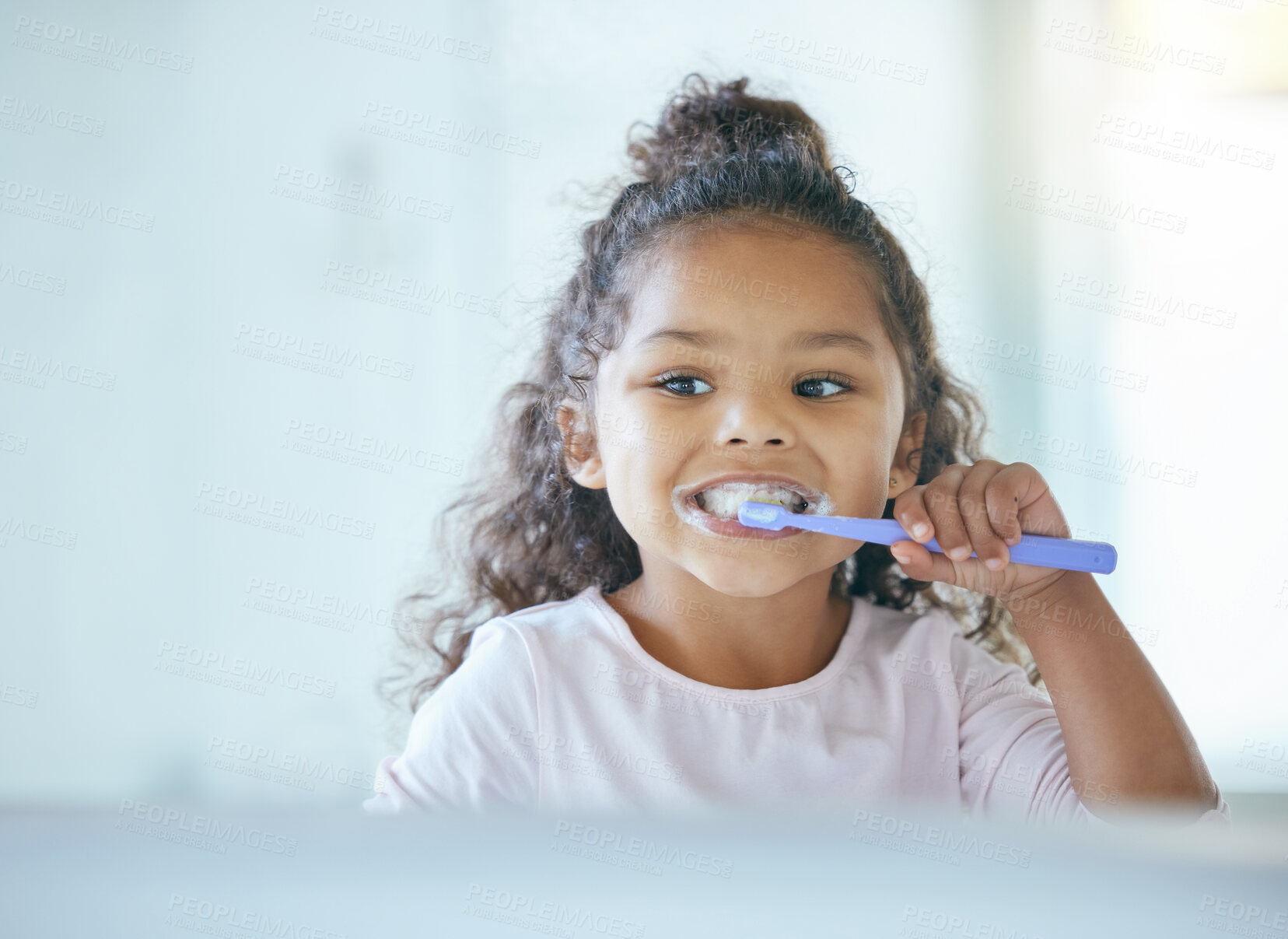 Buy stock photo Girl, brushing teeth and smile for hygiene, clean mouth and fresh breath for oral care and dental health. Child, cleaning and toothpaste with toothbrush, bathroom and wellness in family home
