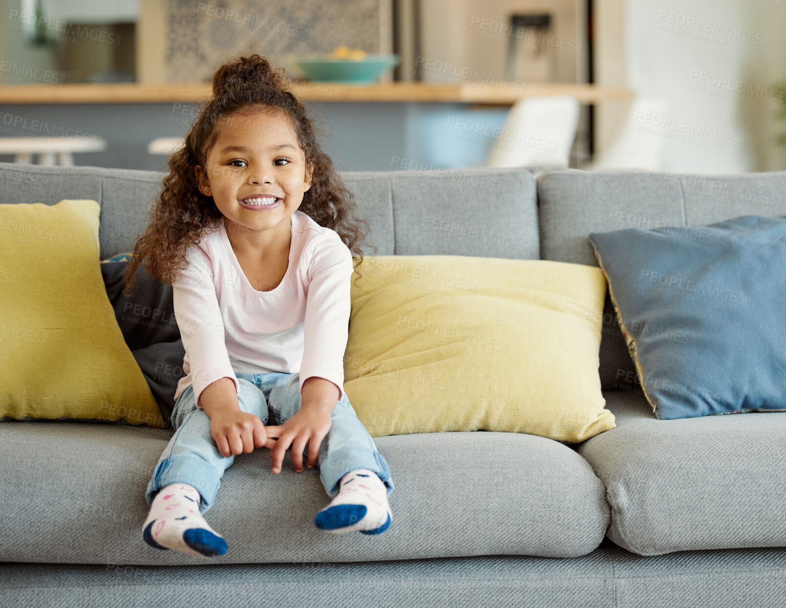 Buy stock photo Portrait of a little girl sitting on the sofa at home