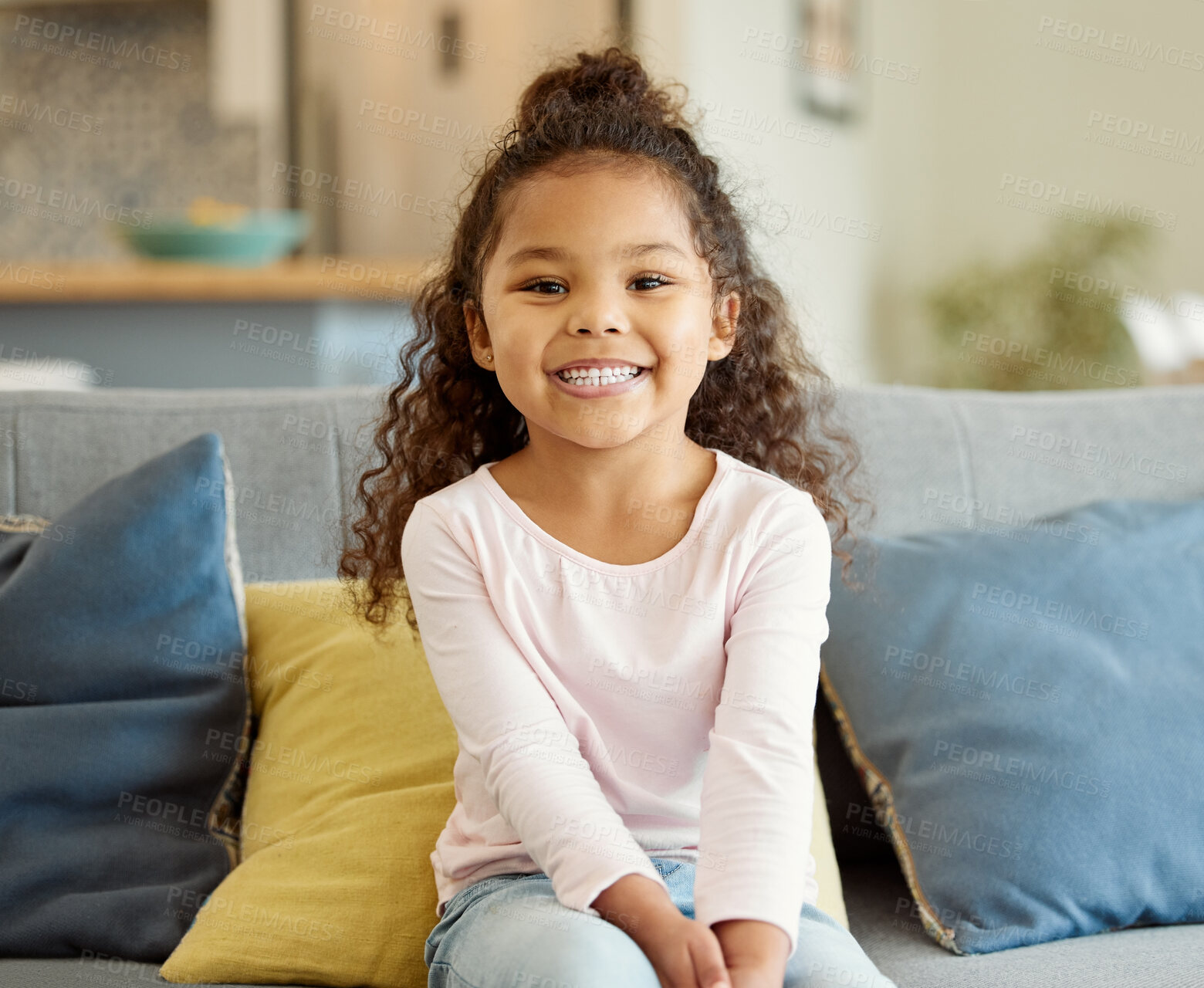 Buy stock photo Portrait of a little girl sitting on the sofa at home