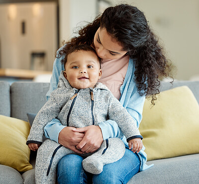 Buy stock photo Shot of a young mother bonding with her baby boy on the sofa at home