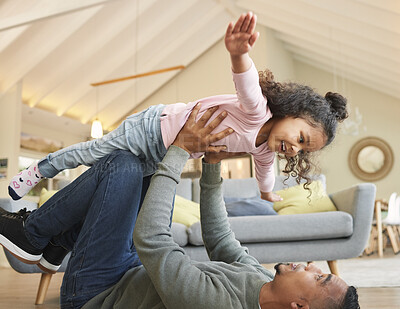 Buy stock photo Shot of a young father and daughter bonding while playing on the floor at home