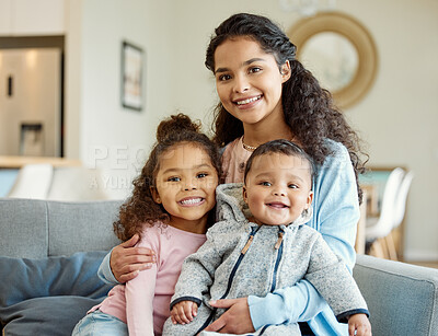 Buy stock photo Shot of a young mother bonding with her kids on the sofa at home