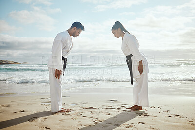 Buy stock photo Beach, bow and people at karate training for exercise, sport and ready to start. Fitness, creative and an Asian man and woman at the ocean for martial arts, samurai fight and learning a skill