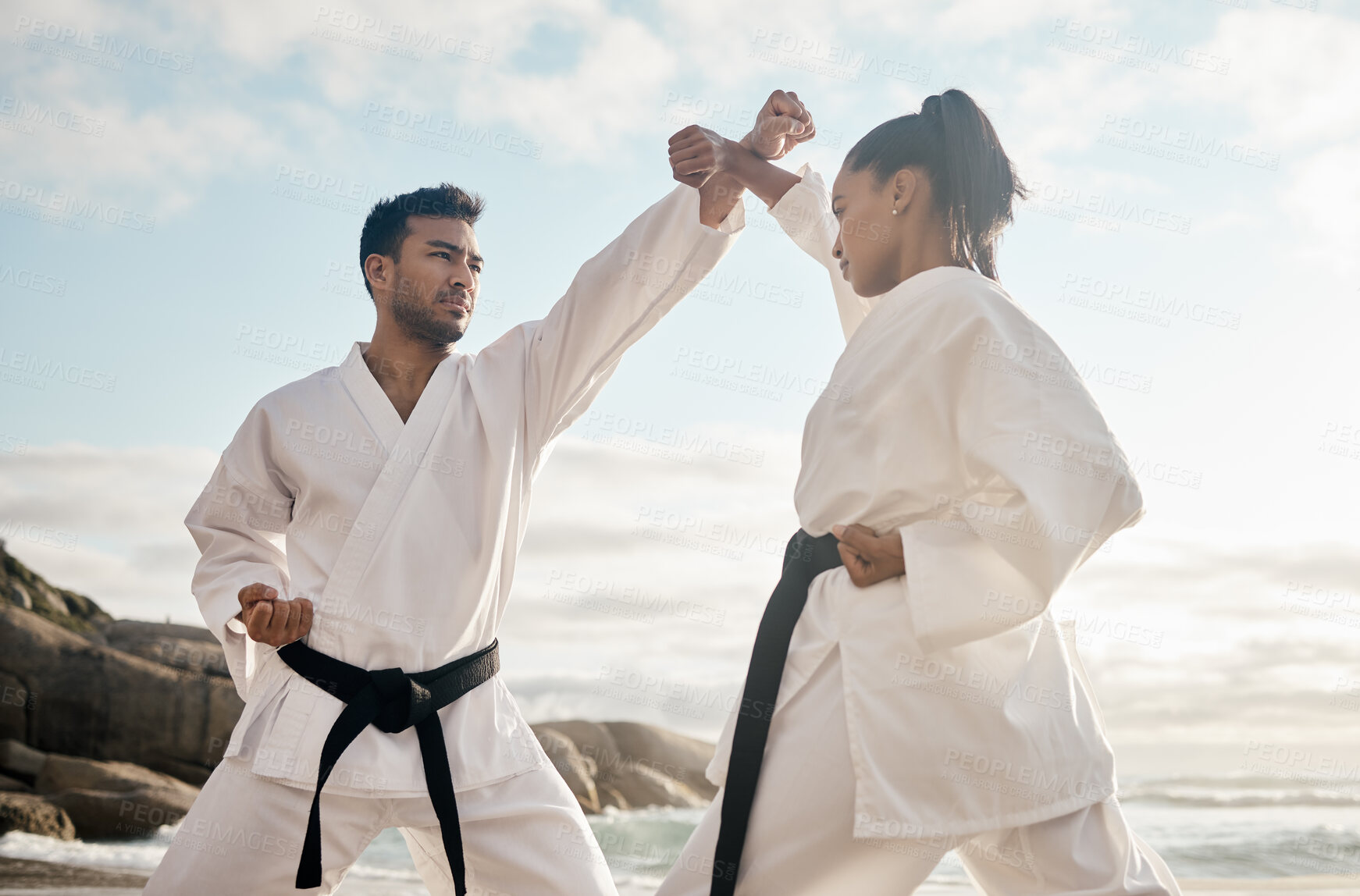 Buy stock photo People, karate and beach for self defense practice, fitness and coach for fighting in outdoor. Friends, exercise and warrior for martial arts in nature, ocean and workout action for teaching by waves