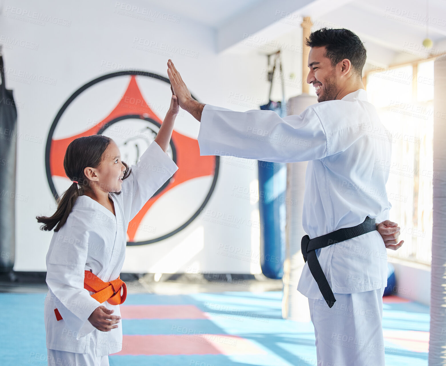 Buy stock photo Martial arts, karate and high five in studio for fitness, teaching and respect with handshake or thank you. Sensei, student and celebration as people for self defense class, gratitude and discipline