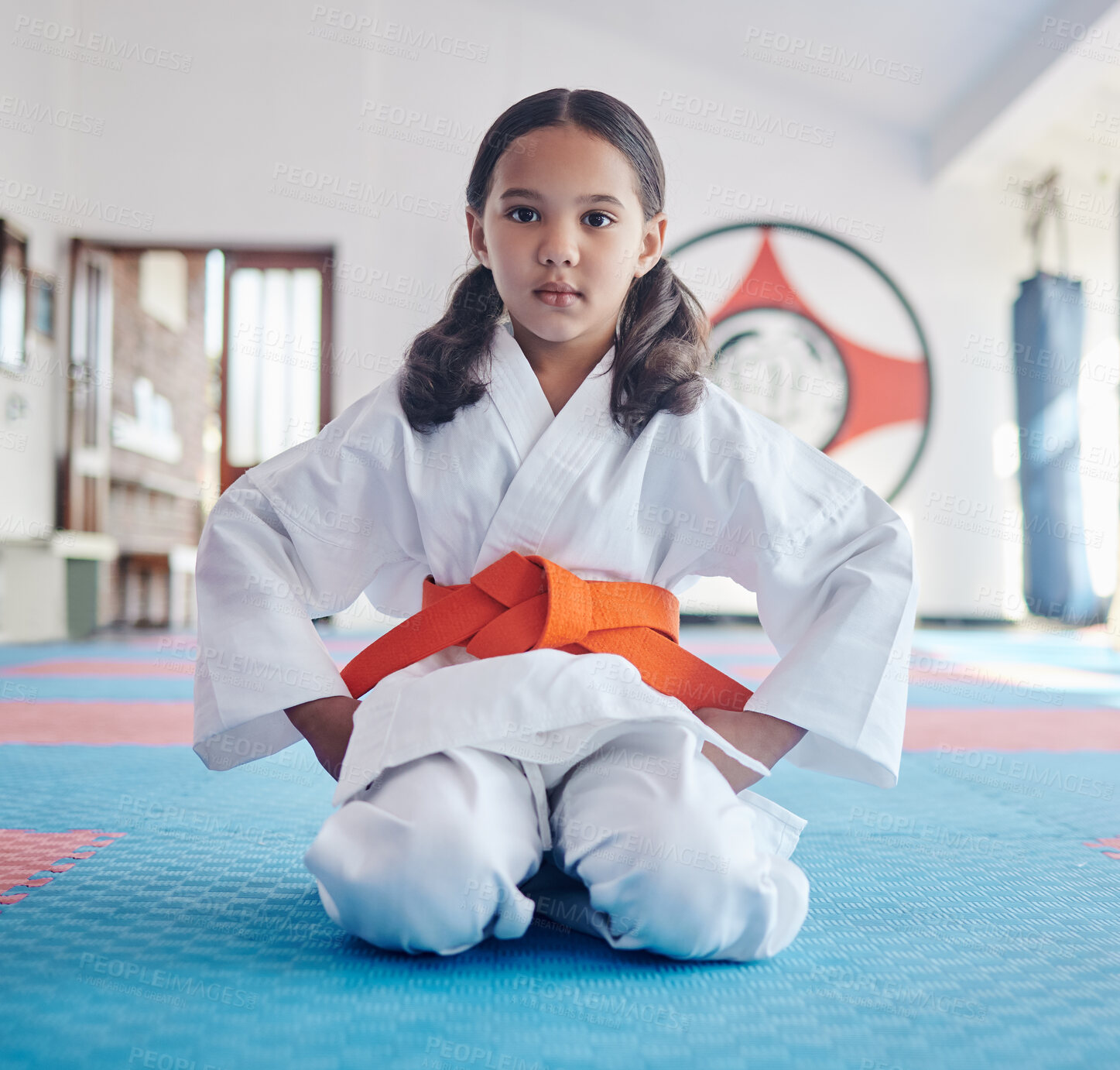 Buy stock photo Child, portrait or girl in dojo for martial arts, training or exercise to prepare for karate education. Respect, warrior or judo student with kid in studio ready for taekwondo practice or workout