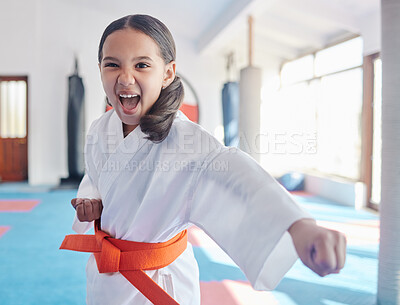 Buy stock photo Shot of a cute little girl practicing karate in a studio
