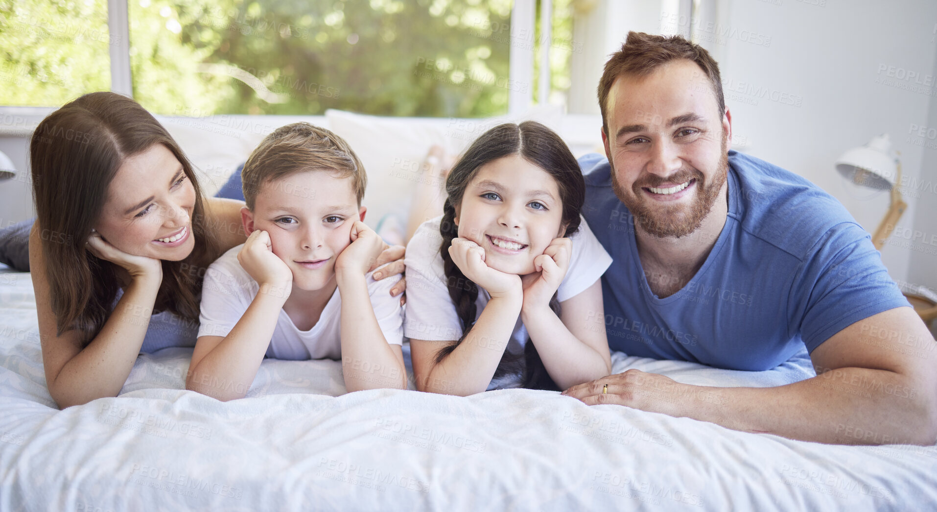 Buy stock photo Happy family, portrait and relax with bed for morning, bonding or holiday weekend together at home. Mother, father and children with smile, son and daughter for wake up or lying in bedroom at house