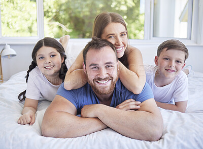 Buy stock photo Shot of a young family spending time together at home