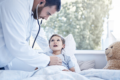 Buy stock photo Shot of a male doctor doing a checkup on a sick little boy at home