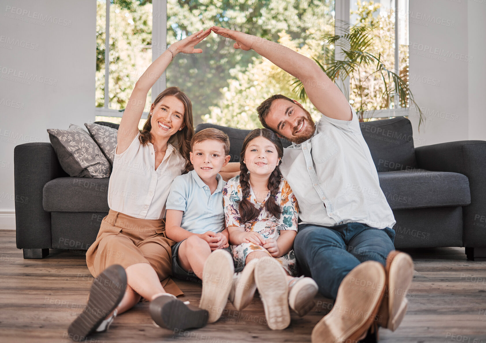 Buy stock photo Hand, home and family in portrait for insurance with safety, protection or security with real estate investment. Parents, kids and happy with roof for house cover, homeowner or mortgage loan on floor